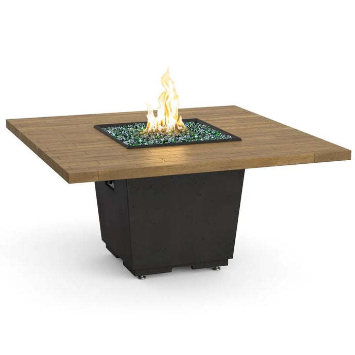 A 60" reclaimed wood dining fire table with a rustic wood top and a sleek black base. The fire pit in the center adds warmth and ambiance to any outdoor space.