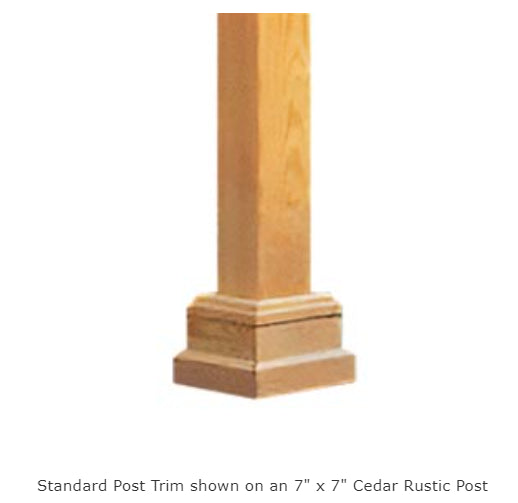  A cedar post with a square base and decorative trim. The post is light brown in color and has a rustic finish