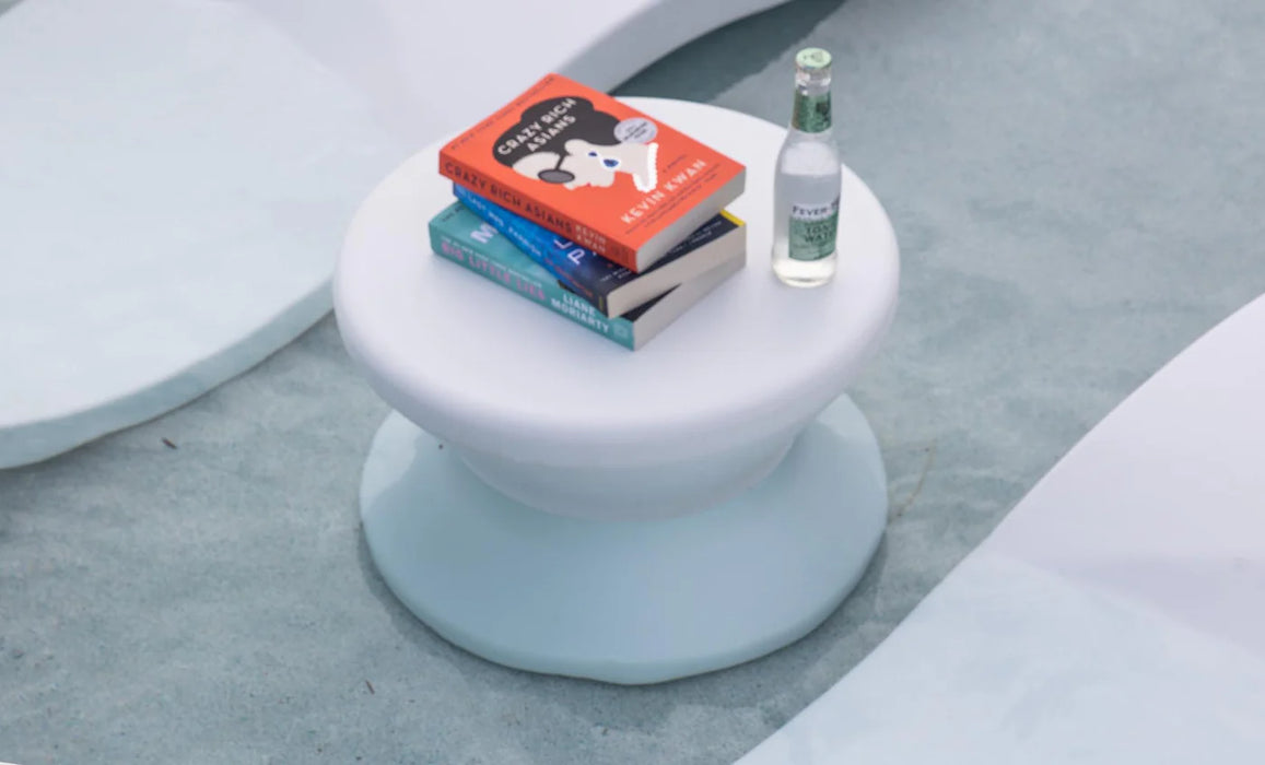 A white Ledge Lounger Signature Standard Side Table, designed for use in and around the pool. It has a sturdy base and a smooth, flat surface.