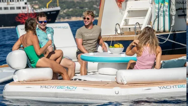 People on a YachtBeach inflatable boat with a scenic background