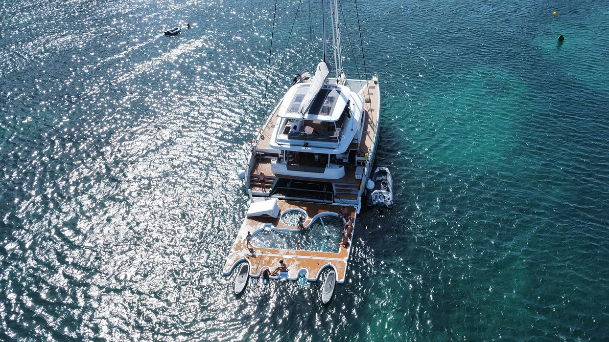 Luxury yacht jet ski dock on a clear blue ocean