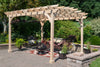 A wooden 10x12 yardcraft pergola in a backyard setting.