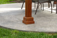 A close-up of a wooden pavilion frame with notched beams and pre-drilled holes for assembly.