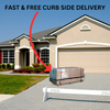 A residential house with a tan exterior and a two-car garage, featuring a package wrapped in plastic on the driveway, with a red arrow pointing to it. A white barrier with "PLEASE STAY OFF DRIVEWAY" signs is in front of the package. A banner at the top reads "FAST & FREE CURB SIDE DELIVERY.